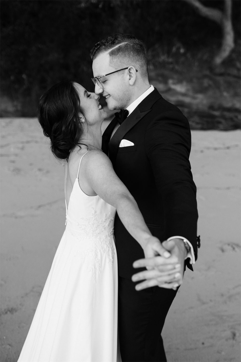 Cute Intimate Moment for Young Stylish Couple at Athol Hall Beach